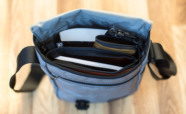 A Small Ghost Whale Pouch in the main compartment of a Small Café Bag.